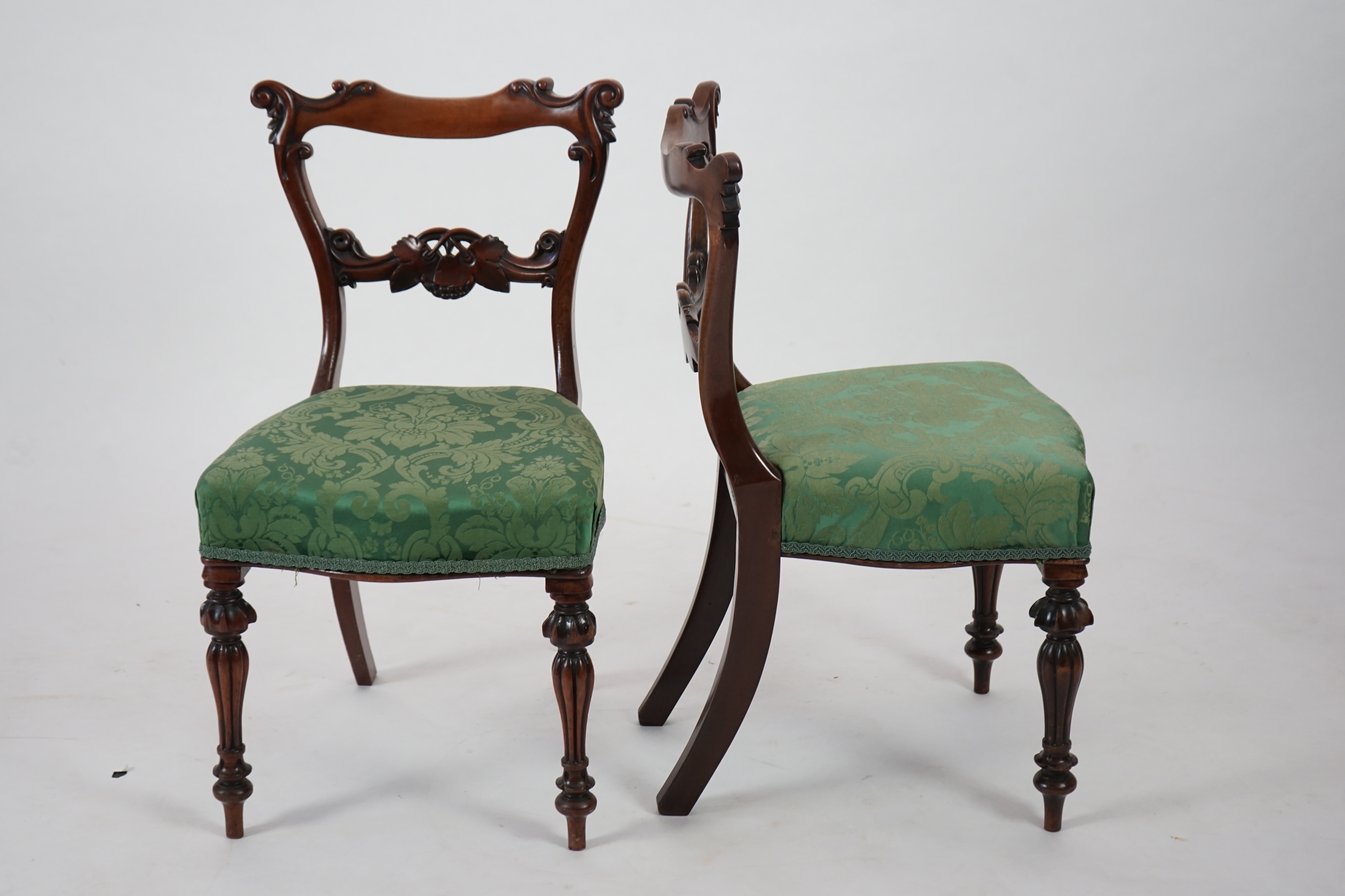 A pair early Victorian mahogany buckle back dining chairs